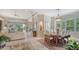 Open floor plan features living and dining area with access to the lanai offering seamless indoor/outdoor living at 7432 Ascot Ct, University Park, FL 34201