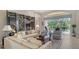 Elegant living room with decorative screen and furnishings, with lanai access offering views of the pool at 7432 Ascot Ct, University Park, FL 34201