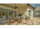 Inviting outdoor patio with a full kitchen, built-in grill, and comfortable seating at 7432 Ascot Ct, University Park, FL 34201
