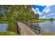 Scenic view of a wooden bridge over a pond at the University Park golf course, creating a peaceful atmosphere at 7432 Ascot Ct, University Park, FL 34201