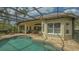 Beautiful screened pool with brick paver deck and covered patio, perfect for relaxing and entertaining at 7432 Ascot Ct, University Park, FL 34201
