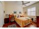 Bright bedroom featuring wood floors, closet, neutral paint, and a large window to let in light at 7762 Us Open Loop, Lakewood Ranch, FL 34202