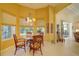 Cozy breakfast nook with pool view, bright lighting, and outdoor access at 7762 Us Open Loop, Lakewood Ranch, FL 34202