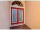 Front door with glass inserts and arched transom at 7762 Us Open Loop, Lakewood Ranch, FL 34202