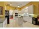 Bright kitchen featuring white cabinets, stainless appliances, and island at 7762 Us Open Loop, Lakewood Ranch, FL 34202