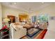Living area featuring an open-concept layout with lanai access and stylish decor at 7762 Us Open Loop, Lakewood Ranch, FL 34202