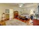 Spacious main bedroom with a ceiling fan, hardwood floors, and a large walk-in closet at 7762 Us Open Loop, Lakewood Ranch, FL 34202