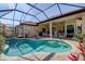 Sparkling in-ground pool with a screen enclosure, patio with lounge seating, and access to the house at 7762 Us Open Loop, Lakewood Ranch, FL 34202