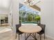 Cozy breakfast nook with views of the screened-in pool area creating a tranquil dining experience at 8122 Spring Marsh Dr, University Park, FL 34201
