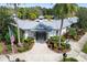 Exterior view of a community clubhouse with manicured landscaping and a welcoming entrance at 8122 Spring Marsh Dr, University Park, FL 34201