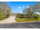 Beautiful one-story home with a manicured lawn and mature landscaping at 8122 Spring Marsh Dr, University Park, FL 34201