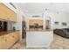 Open concept kitchen with granite counters and breakfast bar, with adjacent living area at 8122 Spring Marsh Dr, University Park, FL 34201