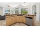 Open kitchen showcasing granite countertops, stainless steel appliances, and views of the pool at 8122 Spring Marsh Dr, University Park, FL 34201