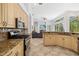 Spacious kitchen featuring granite countertops, stainless steel appliances, and an open floor plan at 8122 Spring Marsh Dr, University Park, FL 34201