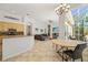 Open floor plan combines kitchen, dining area, and living room with views of the lanai at 8122 Spring Marsh Dr, University Park, FL 34201