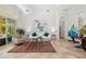 Bright living room with high ceilings, tile floors, stylish furnishings, and large windows offering plenty of light at 8122 Spring Marsh Dr, University Park, FL 34201