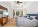 Cozy main bedroom with wood floors, tray ceiling, and views of the pool and backyard at 8122 Spring Marsh Dr, University Park, FL 34201