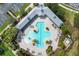 Aerial view of a uniquely shaped pool with ample lounge seating and lush, tropical landscaping at 8122 Spring Marsh Dr, University Park, FL 34201