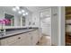 Bathroom with tiled floors, white cabinetry, granite counters, and a separate toilet room at 8735 Midnight Pass Rd # 105B, Sarasota, FL 34242