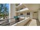 Condo complex featuring multiple units, balconies, covered entry, and secure access at 8735 Midnight Pass Rd # 105B, Sarasota, FL 34242