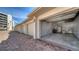 View of a multi-car garage with brick driveway, showing parking and storage available to residents of the community at 8735 Midnight Pass Rd # 105B, Sarasota, FL 34242