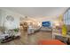 Comfortable living room boasts stylish decor, wood floors, and plenty of natural light at 8735 Midnight Pass Rd # 105B, Sarasota, FL 34242