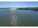 Stunning water view showcasing the beautiful blue ocean and a distant boat dock at 8735 Midnight Pass Rd # 105B, Sarasota, FL 34242