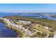 Beautiful aerial of waterfront community and lush surrounding landscape at 92 Tidy Island Blvd, Bradenton, FL 34210