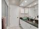 Modern bathroom featuring a vessel sink, granite countertop, and a glass-enclosed shower at 92 Tidy Island Blvd, Bradenton, FL 34210