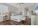 Comfortable bedroom featuring hardwood floors, neutral tones, and ample natural light at 92 Tidy Island Blvd, Bradenton, FL 34210