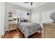 Charming bedroom with wood floors, a ceiling fan, and ample closet space for storage at 92 Tidy Island Blvd, Bradenton, FL 34210