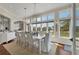 Bright dining room with beautiful views, stylish lighting, and seating for six at 92 Tidy Island Blvd, Bradenton, FL 34210