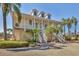 Elegant two-story home featuring a charming porch, well-manicured landscaping and welcoming curb appeal at 92 Tidy Island Blvd, Bradenton, FL 34210