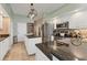 Spacious kitchen with granite countertops, stainless steel appliances, and ample cabinet space at 92 Tidy Island Blvd, Bradenton, FL 34210