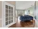Stylish living room featuring hardwood floors, large windows, and a comfortable seating area at 92 Tidy Island Blvd, Bradenton, FL 34210