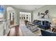 Bright living room features comfortable seating, a modern coffee table, and beach-themed decor at 92 Tidy Island Blvd, Bradenton, FL 34210