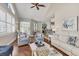 Bright and airy living room featuring hardwood floors and comfortable seating arrangements at 92 Tidy Island Blvd, Bradenton, FL 34210