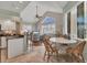 Inviting living space with travertine tile floors, breakfast nook, and high ceilings at 92 Tidy Island Blvd, Bradenton, FL 34210