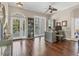 Bright office space with hardwood floors, French doors, custom built-ins, and elegant furnishings at 92 Tidy Island Blvd, Bradenton, FL 34210