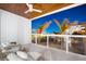 Balcony featuring cozy seating with a ceiling fan, a wood plank ceiling, and neighborhood views at 1035 Seaside Dr # 308, Sarasota, FL 34242