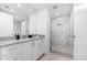 Modern bathroom with sleek vanity, marble shower and glass door at 1035 Seaside Dr # 308, Sarasota, FL 34242