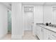 Bathroom featuring stone countertops, white cabinets, and a large walk-in shower at 1035 Seaside Dr # 308, Sarasota, FL 34242