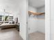 Bedroom with a ceiling fan, floor to ceiling windows, and a walk-in closet at 1035 Seaside Dr # 308, Sarasota, FL 34242