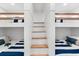 Fun ' bedroom with unique bunk beds and a modern ladder, perfect for siblings or sleepovers at 1035 Seaside Dr # 308, Sarasota, FL 34242