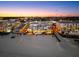 Stunning condo exterior with beach access and city views at dusk at 1035 Seaside Dr # 308, Sarasota, FL 34242