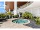 Relaxing hot tub area with lush landscaping and modern design at 1035 Seaside Dr # 308, Sarasota, FL 34242