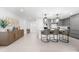 Spacious kitchen with modern appliances, a large island with seating, and stylish pendant lighting at 1035 Seaside Dr # 308, Sarasota, FL 34242