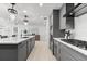 Modern kitchen with island, stainless appliances, and open layout to the living space at 1035 Seaside Dr # 308, Sarasota, FL 34242