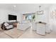 Inviting living room and dining area with large windows offering plenty of natural light at 1035 Seaside Dr # 308, Sarasota, FL 34242