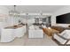 Bright, open-concept living space connects the living room, dining area, and modern kitchen for seamless entertaining at 1035 Seaside Dr # 308, Sarasota, FL 34242